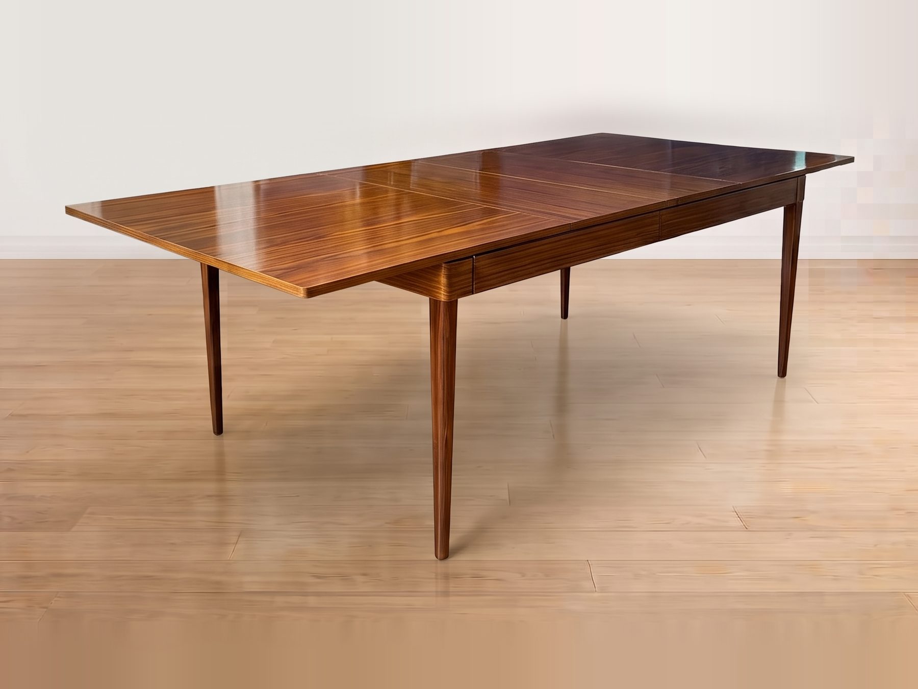 A six-leaf solid Mahogany dining table with tapered legs